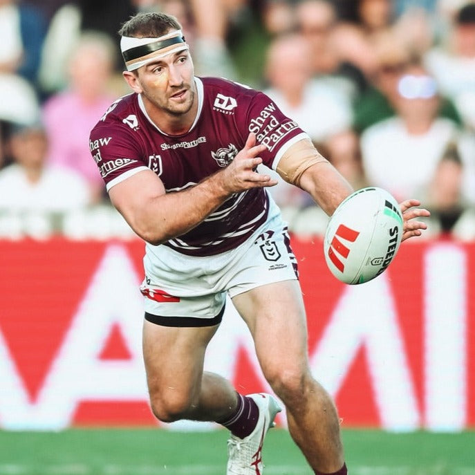 Image Of Lachlan Croker Passing Ball On Field In Stadium
